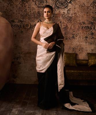 Peach embroidered blouse with black and peach colour block saree 1