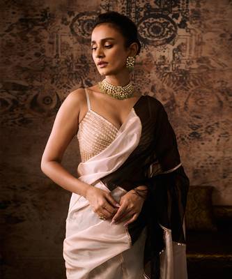 Peach embroidered blouse with black and peach colour block saree 4