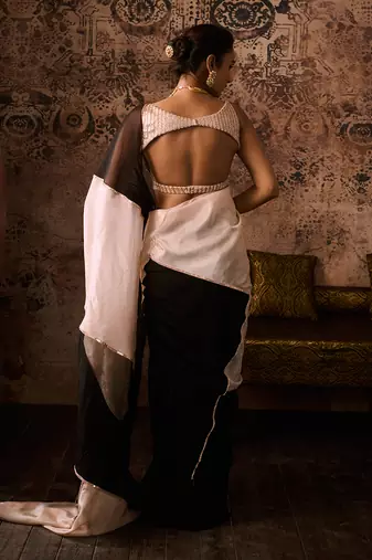 Peach embroidered blouse with black and peach colour block saree
