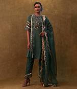 Emerald green kurta set paired with pants and organza dupatta