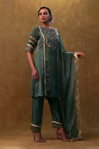 Emerald green kurta set paired with pants and organza dupatta