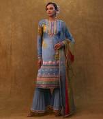 Ocean blue printed kurta set paired with color block dupatta and flared pants.