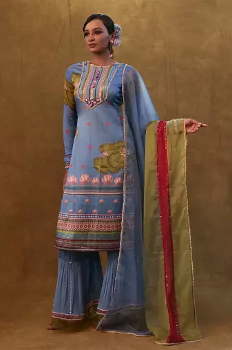 Ocean blue printed kurta set paired with color block dupatta and flared pants.