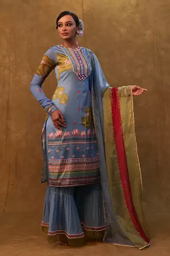 Ocean blue printed kurta set paired with color block dupatta and flared pants.