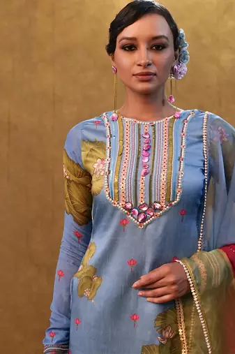 Ocean blue printed kurta set paired with color block dupatta and flared pants.
