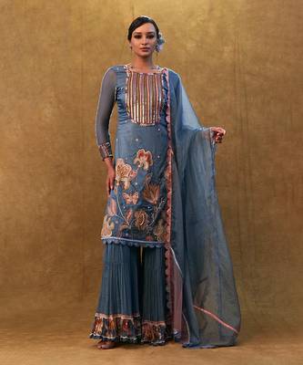 Blue applique work kurta set paired with flared sharara and a dupatta. 1