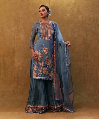 Blue applique work kurta set paired with flared sharara and a dupatta. 3