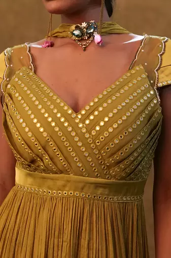 Olive peplum set paired with pants and a neck dupatta