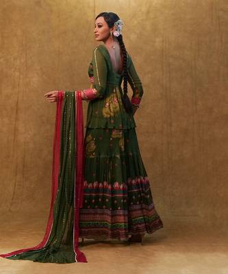 Green printed sharara set paired with color block dupatta and a peplum. 2