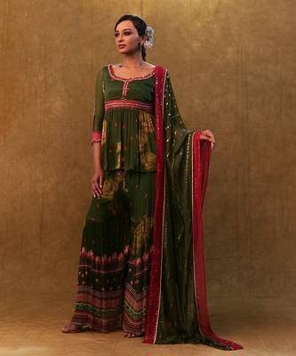 Green printed sharara set paired with color block dupatta and a peplum. 3