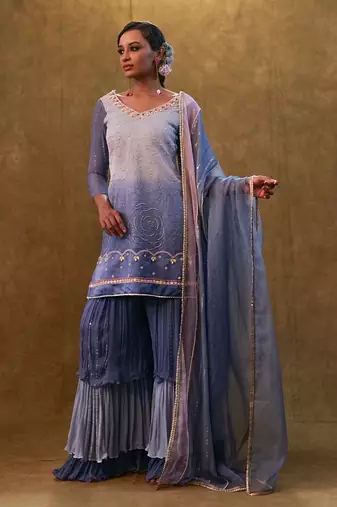 Ice blue shaded sharara set paired with dupatta and layered colour block sharara.