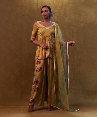 Mustard printed peplum set paired with dupatta and pants 1