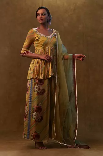Mustard printed peplum set paired with dupatta and pants