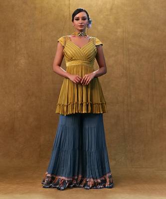 Sharara set paired with flared top and a neck dupatta. 1