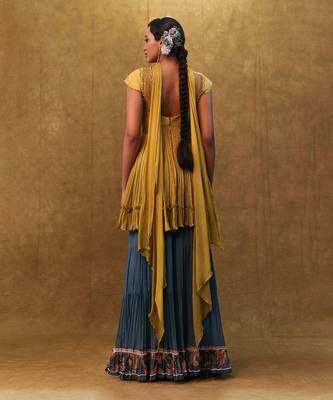 Sharara set paired with flared top and a neck dupatta. 2