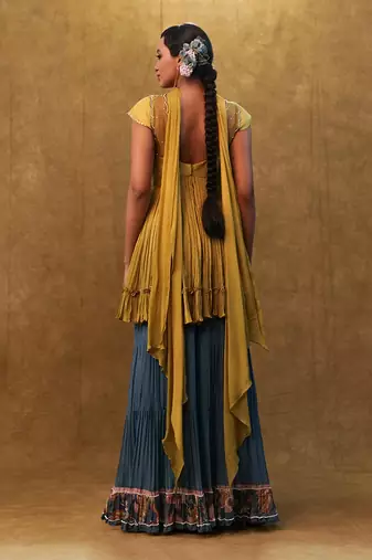 Sharara set paired with flared top and a neck dupatta.
