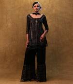Black kurta set paired with fringe dupatta and flared pants