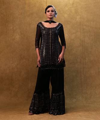 Black kurta set paired with fringe dupatta and flared pants 2