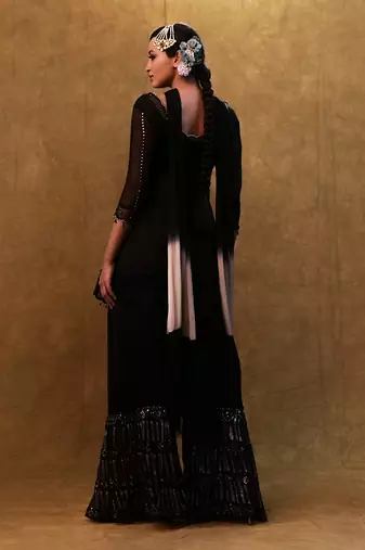 Black kurta set paired with fringe dupatta and flared pants
