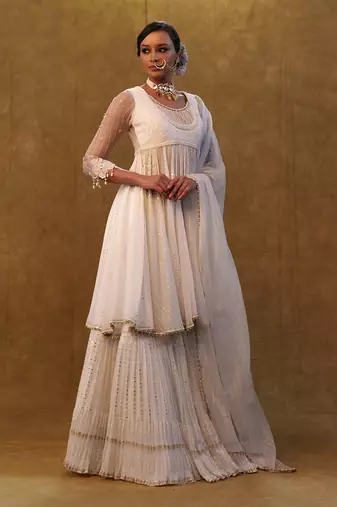 White anarkali set paired with skirt and dupatta