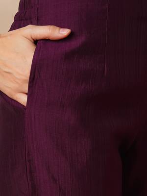A-line pocketed silk blend kurta with zari embroidery and pleat detailing paired with lined pants. 5