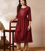 A-line gathered silk blend kurta with zari embroidery and a side pocket.