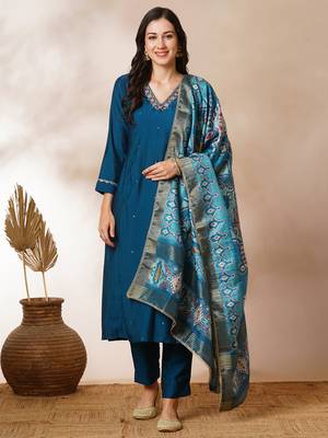 A-line silk blend kurta with zari embroidery detailing paired with printed dupatta and silk blend pants. 1