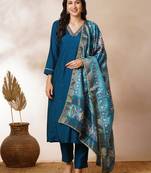 A-line silk blend kurta with zari embroidery detailing paired with printed dupatta and silk blend pants.