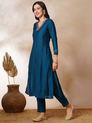 A-line silk blend kurta with zari embroidery detailing paired with printed dupatta and silk blend pants. 3