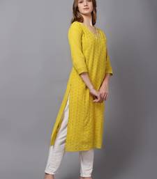 Yellow cambric chikankari kurti with handwork