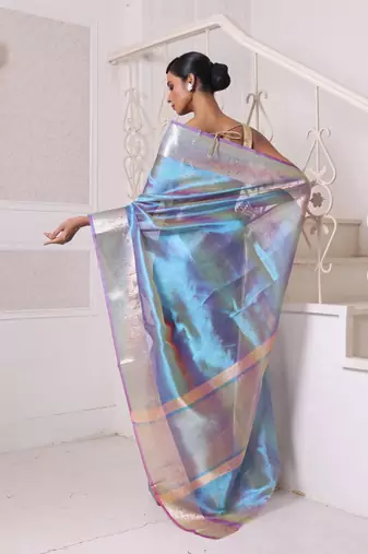 Teal dual-tone tissue saree with zari borders