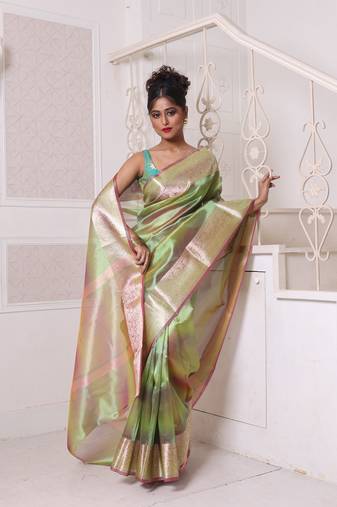 Green dual-tone tissue saree with zari borders