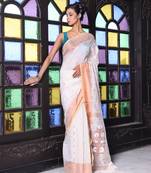 Beige cotton saree with zari borders