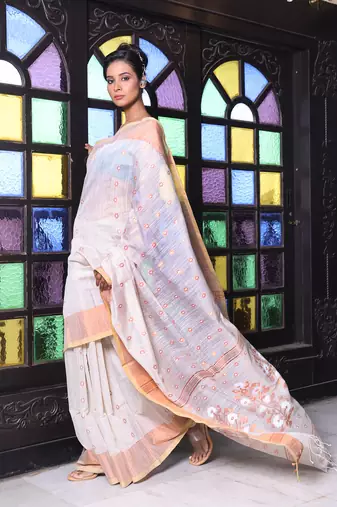 Beige cotton saree with zari borders