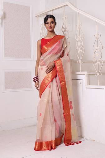 Beige muslin saree with zari woven nakshi borders