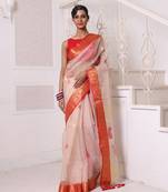 Beige muslin saree with zari woven nakshi borders