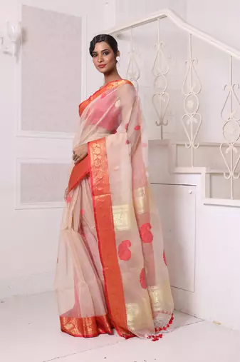 Beige muslin saree with zari woven nakshi borders