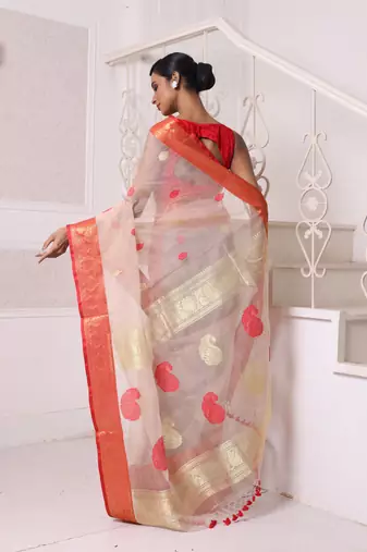 Beige muslin saree with zari woven nakshi borders