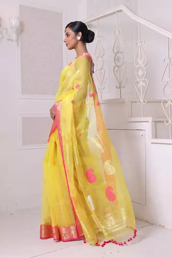 Yellow muslin saree with zari woven nakshi borders