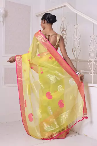 Yellow muslin saree with zari woven nakshi borders