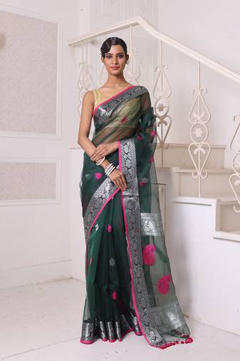 Emerald green muslin saree with zari woven nakshi borders