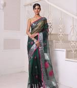 Emerald green muslin saree with zari woven nakshi borders