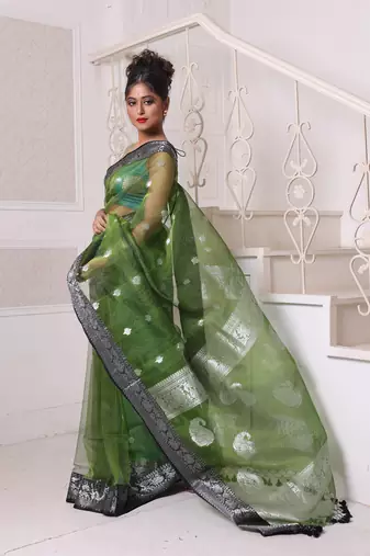 Green muslin saree with zari woven nakshi borders
