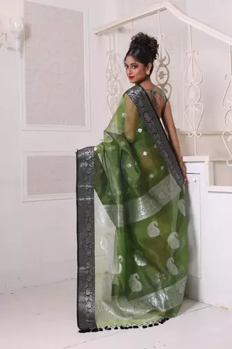 Green muslin saree with zari woven nakshi borders