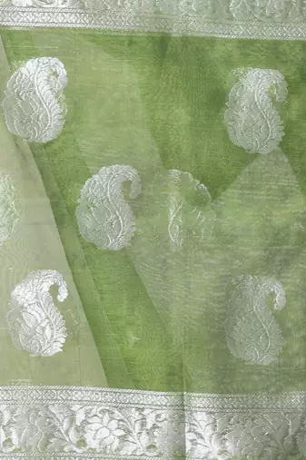 Green muslin saree with zari woven nakshi borders