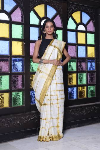 All over foliage embroidery white and mustard silk saree with chanderi borders