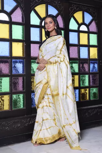 All over foliage embroidery white and mustard silk saree with chanderi borders