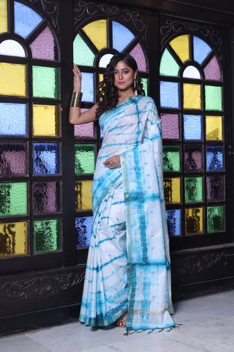 All over foliage embroidery white and sky blue silk saree with chanderi borders