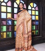 Beige printed silk soft saree with printed borders