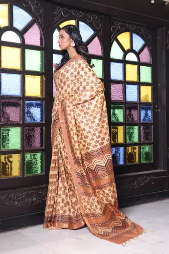 Beige printed silk soft saree with printed borders
